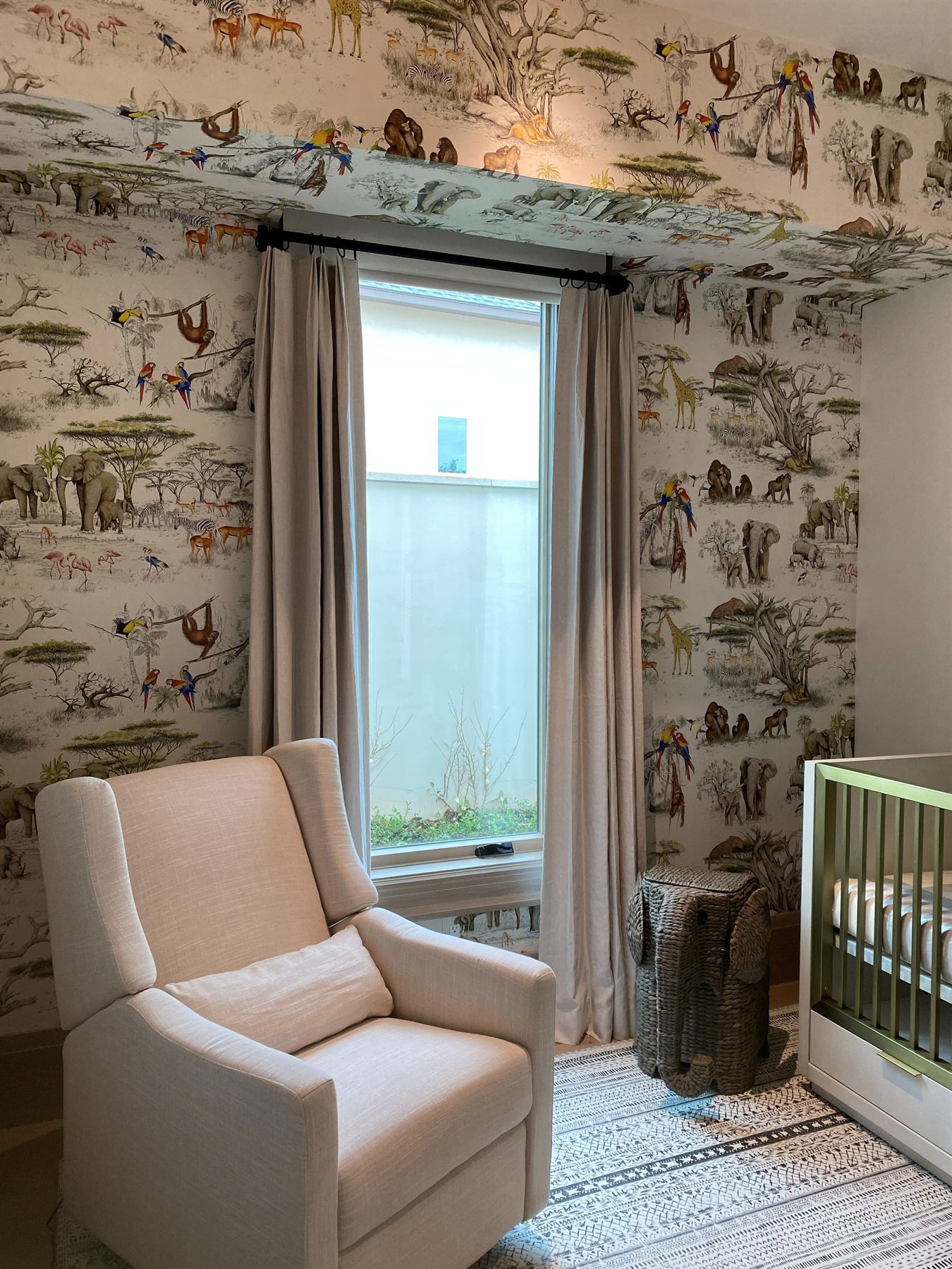 Nursery with safari animal wallpaper